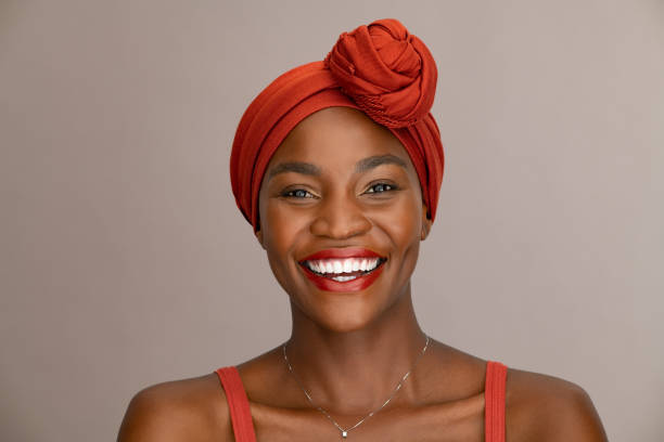 istock Laughing black woman with ethnic headscarf looking at camera 1333518304