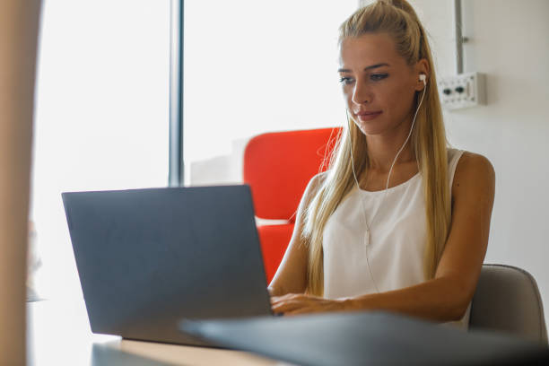 istock Young female entrepreneur typing work data on laptop 1333523100