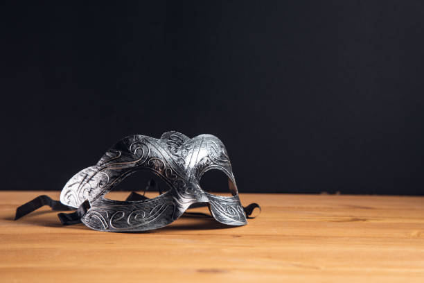 istock masquerade mask on a wooden table 1333525804