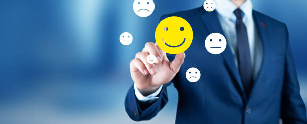 istock man holding smiling face icons 1333525836