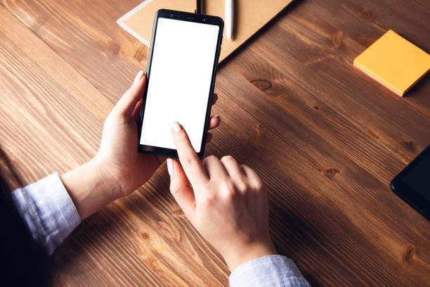 istock young woman holding smart phone 1333525878