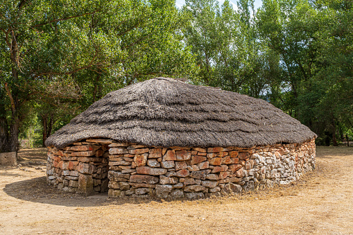 Prehistoric dry stone house and thatched roof