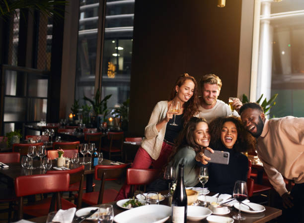 istock Friends taking selfie on phone in restaurant 1333526287