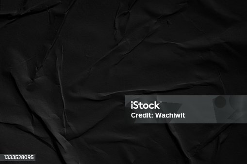 istock Weathered black paper texture background 1333528095