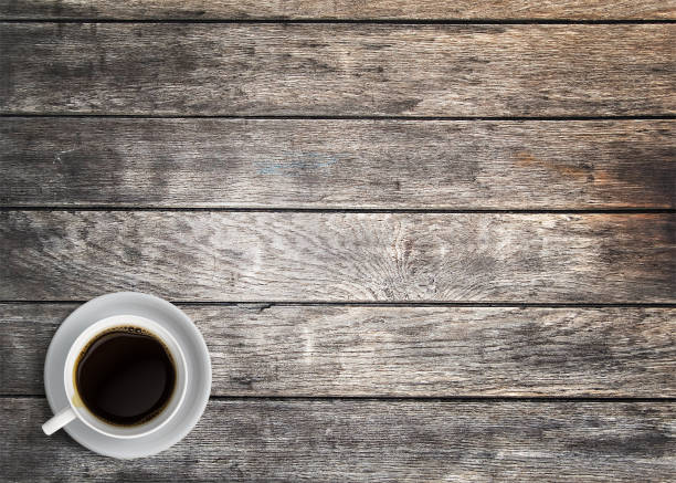 istock black coffee isolated on wooden table 1333528307
