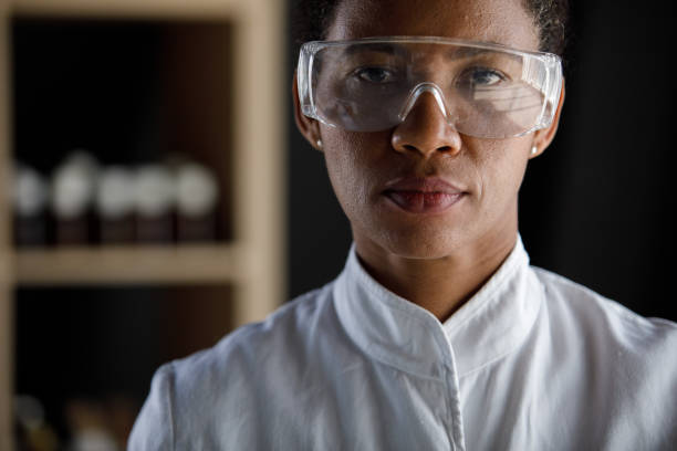 istock Serious female scientist wearing protective eyewear and looking at camera 1333528713