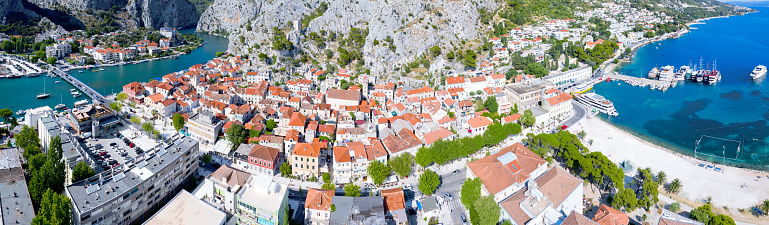 Panoramic aerial view of the old Croatian town of Omis and the river Cetina, which flows into the Adriatic Sea