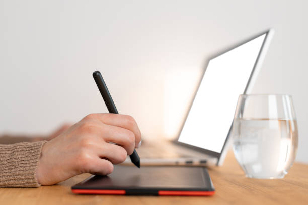 istock Graphic designer work with digital graphic tablet and laptop. 1333531079
