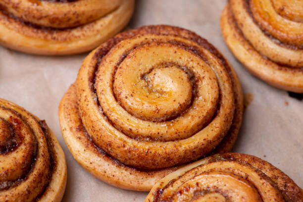 istock Many fresh baked buns with cinnamon on baking paper 1333532288
