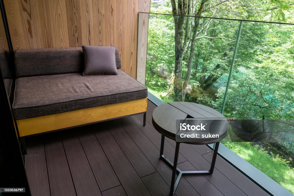 riverside balcony with table and sofa Hotel Stock Photo