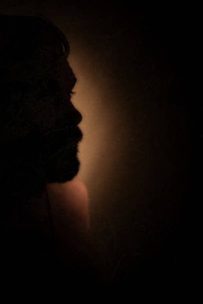 istock silhouette of man in darkness 1333539245