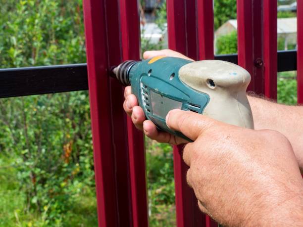 istock Construction of a fence in the garden. 1333542707