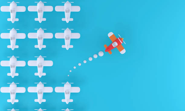 istock Group of white planes in one direction and one red plane pointing the other on a blue background. business for new ideas Creativity, innovation, independence and problem solving 1333542816