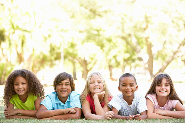 istock Group Of Schoolchildren Standing In Park 133354375