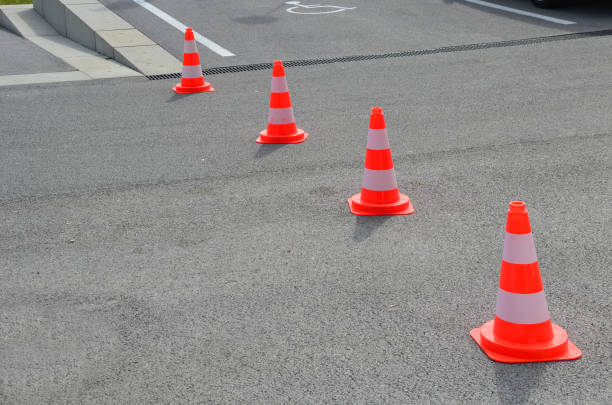 istock Traffic cones are a necessary aid, especially when repairing roads and sidewalks, warning drivers and pedestrians of an obstacle on the road, earthworks. 1333544869