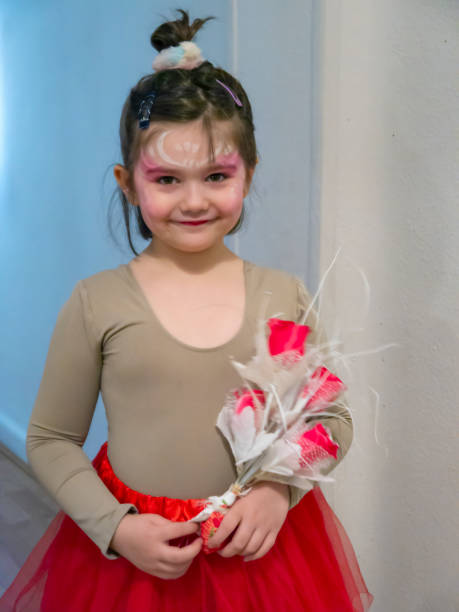 istock Little ballerina with a flower bouquet 1333545895