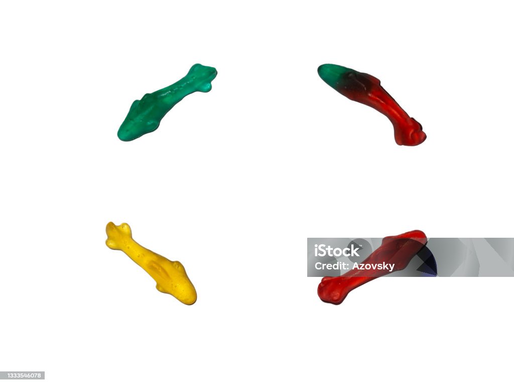 Unhealthy, junk food. Marmalade, gelatin, chewy, transparent and colored sweet sea sharks. Backgrounds Stock Photo