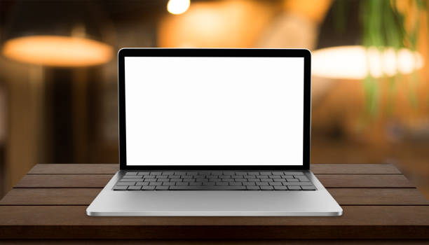 istock Laptop with blank screen on table with blurred restaurant background 1333547731