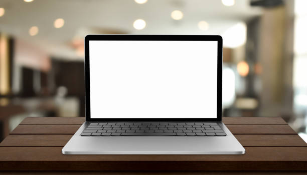 istock Laptop with blank screen on table with blurred restaurant background 1333547738
