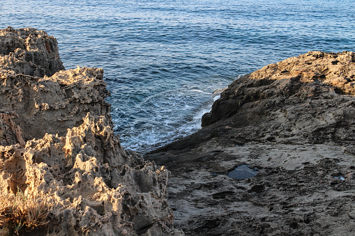 Sharp gray rocks against the sea. Ayia Napa. Cyprus.