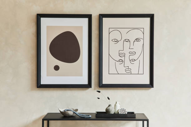 istock Creative composition of stylish modern living room interior with two mock up poster frames, black geometric commode, armchair, lamp and personal accessories. Neutral colours. Template. 1333557274