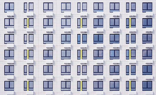 Exterior of the white new apartment building after construction.