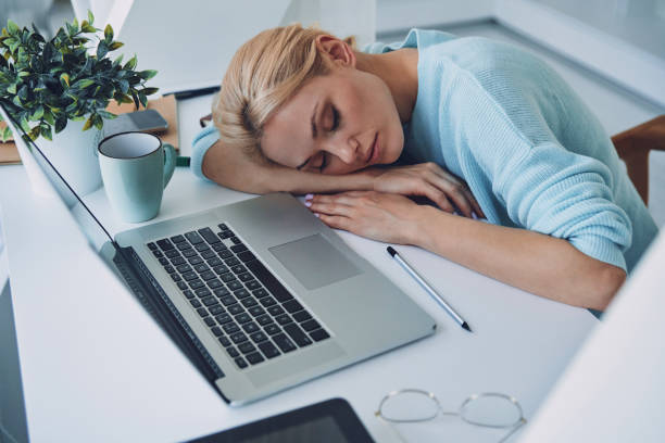 istock Top view of tired young woman sleeping 1333557667