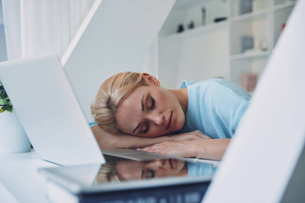istock Tired young woman sleeping 1333557890