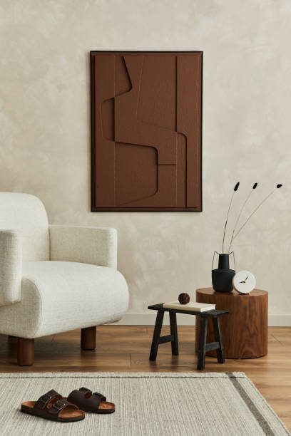 istock Stylish composition of modern cozy living room interior with structure painting on the wall, beige armchair and personal accessories. Neutral creative wall, carpet on the parquet floor. Template. 1333558564