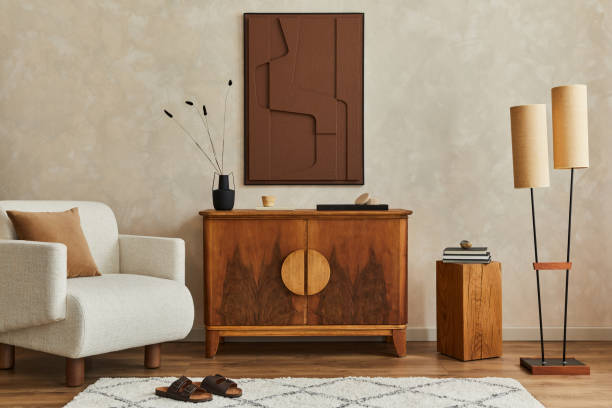 istock Stylish composition of modern living room interior with structure painting, folding screen, vintage commode, armchair, wooden cubes and accessories. Creative wall, carpet on the floor. Template. 1333558898
