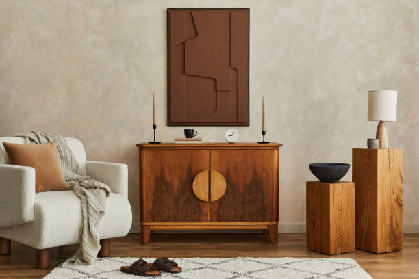 istock Stylish composition of modern living room interior with structure painting, folding screen, vintage commode, armchair, wooden cubes and accessories. Creative wall, carpet on the floor. Template. 1333558943