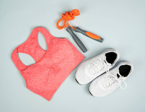 istock Workout clothes top, sneakers, skipping rope on a gray background. 1333562035