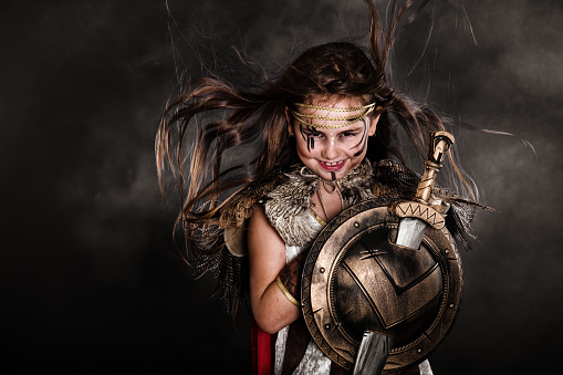 A 7 years old little girl wearing a warrior costume, Quebec, Canada