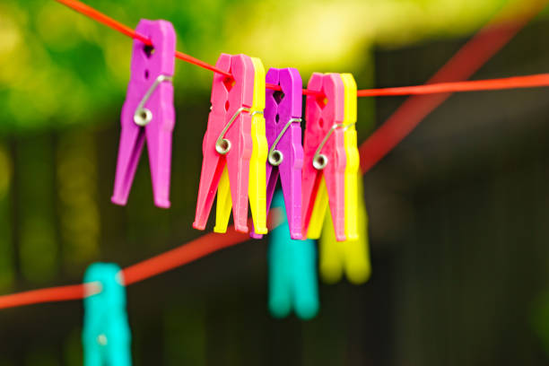 istock Clothes pegs on line outdoor. Housework 1333564094