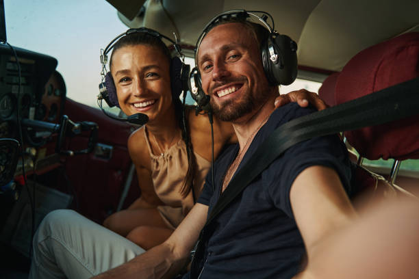 istock Young happy female sitting in the cockpit 1333564583