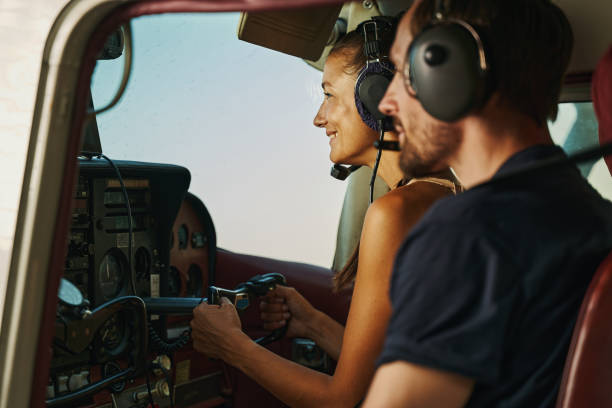 istock Two young people sitting in the cockpit 1333564593
