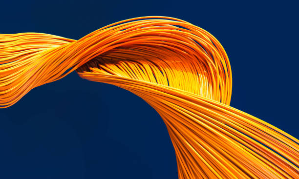 istock fiber optic cables orange color on a blue background. 1333568219