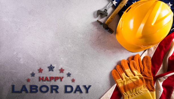 istock Happy Labor day concept. American flag with different construction tools and the text on dark stone background. 1333569764