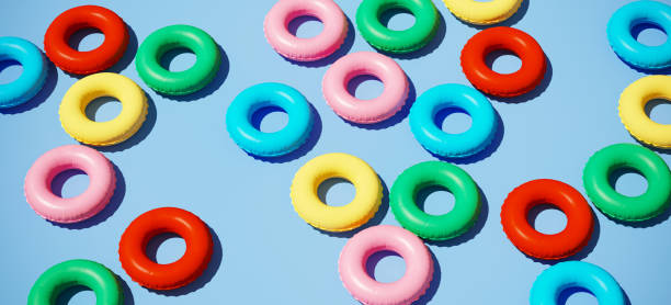 istock Colorful swim rings float on pool water, 3d rendering Stock Picture 1333569813