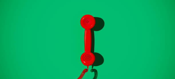 istock Red vintage handset on green background, 3d rendering Stock Picture 1333569814