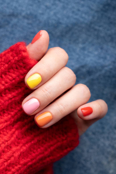 istock Female hand with colorful manicure. 1333569848