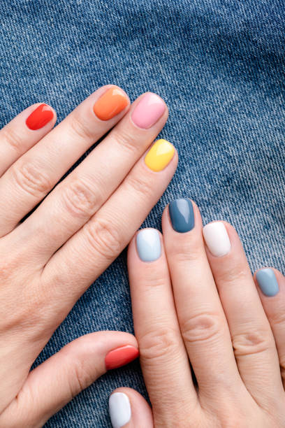 istock Female hands with colorful manicure. 1333569855