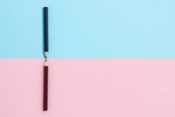 istock Comparison of Two Objects Blocks Pencils Sticker Notes Facing Inward Outward Making An Arrangement Reflection On a Separated Coloured Background Shot In A Flat Lay Perspective 1333569984