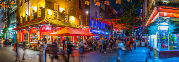 london nightlife crowds of people in chinatown restaurants bars panorama - praça leicester imagens e fotografias de stock