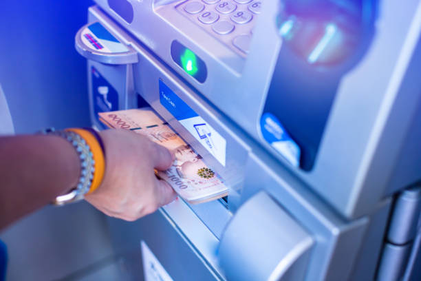 istock Customers withdraw money from ATM 1333573818