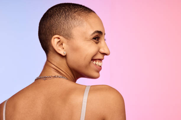 istock Smiling woman with shaved head 1333573917