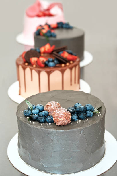 istock Festively decorated cakes on table. Confectionery for holiday 1333575673
