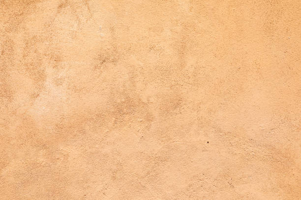 istock background of orange plaster wall 1333580820