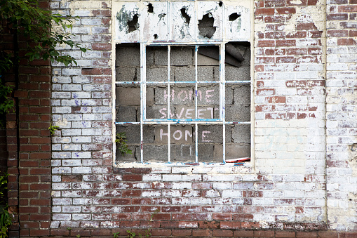 Old broken windows. vandalism. abandoned dilapidated building