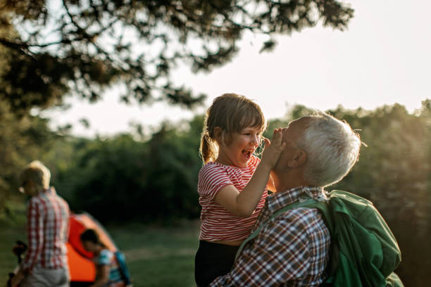 istock Grandfather playing with granddaughter 1333586892